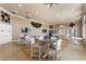 Versatile game room with tables, chairs, ceiling fans, and ping pong table for recreational activities at 248 Rosso Dr, Davenport, FL 33837