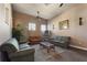 Comfortable lounge area featuring couches, coffee table, ceiling fan and a bookshelf for reading at 248 Rosso Dr, Davenport, FL 33837