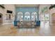 Spacious lounge area with high ceilings, elegant decor, and comfortable seating provides relaxation for residents at 248 Rosso Dr, Davenport, FL 33837