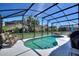 Screened in-ground pool with outdoor furniture, BBQ, and lush landscaping creating a private backyard oasis at 248 Rosso Dr, Davenport, FL 33837