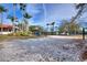 Sand volleyball court provides residents with a relaxing sport, along with a covered seating area for relaxation at 248 Rosso Dr, Davenport, FL 33837