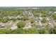 An aerial shot showcases the neighborhood's mature trees and proximity to amenities in a desirable community setting at 2502 Falkner Rd, Orlando, FL 32810
