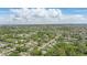 Sprawling aerial view of a neighborhood with tree-lined streets showing community feel with easy access to city amenities at 2502 Falkner Rd, Orlando, FL 32810