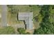 Birds-eye view of the home showing the roof, backyard, driveway, and mature trees on a well-maintained lot at 2502 Falkner Rd, Orlando, FL 32810