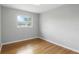 Bedroom featuring hardwood floors, a window with a view, and ample natural light at 2502 Falkner Rd, Orlando, FL 32810