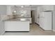Classic kitchen with white cabinetry and adjacent dining area at 2502 Falkner Rd, Orlando, FL 32810