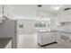 Bright kitchen features open shelving and eat in bar at 2502 Falkner Rd, Orlando, FL 32810
