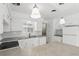 Updated kitchen featuring white cabinets, and modern appliances at 2502 Falkner Rd, Orlando, FL 32810