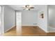 Bright living room featuring hardwood floors, ceiling fan, and natural light at 2502 Falkner Rd, Orlando, FL 32810