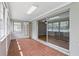 Bright sunroom featuring tile flooring and a seamless transition to the indoors at 2502 Falkner Rd, Orlando, FL 32810