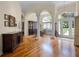 Formal dining room with hardwood floors, featuring large windows and refined furnishings at 2544 Carter Grove Cir, Windermere, FL 34786