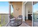 Relaxing balcony with seating, table, and views of the neighborhood at 2774 Almaton Loop # 403, Kissimmee, FL 34747