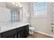 Bright bathroom featuring a double sink vanity with a white countertop and wooden flooring at 2774 Almaton Loop # 403, Kissimmee, FL 34747