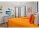 Charming bedroom with two twin beds, colorful dinosaur wall decor, matching curtains, and a modern dresser at 2774 Almaton Loop # 403, Kissimmee, FL 34747