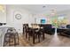 Dining area and living room with balcony access in an open-concept floor plan at 2774 Almaton Loop # 403, Kissimmee, FL 34747