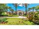 Beautiful community clubhouse surrounded by manicured lawns and tropical landscaping at 2774 Almaton Loop # 403, Kissimmee, FL 34747