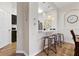 Kitchen bar with pendant lighting and adjacent view of the dining area at 2774 Almaton Loop # 403, Kissimmee, FL 34747