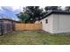 Wood fenced backyard creating a private retreat, enhanced by lush greenery and natural light at 3440 S Nashville Ave, Orlando, FL 32839
