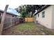 Private backyard featuring wood fencing, an outdoor shed, and an efficient air conditioning unit at 3440 S Nashville Ave, Orlando, FL 32839