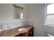 This bathroom features a tiled backsplash, granite countertop, vanity and modern fixtures at 3440 S Nashville Ave, Orlando, FL 32839