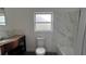 This bathroom features a tiled shower, and white marble style backsplash, vanity and fixtures at 3440 S Nashville Ave, Orlando, FL 32839
