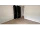 This minimalist bedroom includes a closet with bi-fold doors at 3440 S Nashville Ave, Orlando, FL 32839