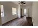 This bedroom offers natural light and vinyl flooring with a ceiling fan for added comfort at 3440 S Nashville Ave, Orlando, FL 32839
