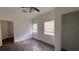 This bedroom offers natural light and vinyl flooring with a ceiling fan for added comfort at 3440 S Nashville Ave, Orlando, FL 32839