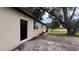 Single-story home featuring a side entrance, complemented by a well-maintained lawn and landscape at 3440 S Nashville Ave, Orlando, FL 32839