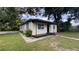 Charming single-story home with a cozy front porch and mature trees providing ample shade at 3440 S Nashville Ave, Orlando, FL 32839