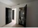 A hallway with multiple doorways leading to rooms throughout the house at 3440 S Nashville Ave, Orlando, FL 32839