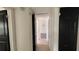 This hallway features clean, white walls and black doors at 3440 S Nashville Ave, Orlando, FL 32839