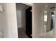 Hallway with neutral colors and views into adjacent rooms at 3440 S Nashville Ave, Orlando, FL 32839
