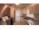 Kitchen featuring stone countertops, stainless appliances and plenty of cabinets at 3440 S Nashville Ave, Orlando, FL 32839