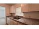 This kitchen features newly updated cabinets and stone countertops at 3440 S Nashville Ave, Orlando, FL 32839