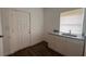 This kitchenette features white cabinets, granite countertops, and a stainless steel sink at 3440 S Nashville Ave, Orlando, FL 32839