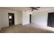 An expansive living room featuring tile floors, neutral colors, and a modern ceiling fan at 3440 S Nashville Ave, Orlando, FL 32839