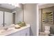 Clean bathroom with modern fixtures, a decorative mirror, and a stylish design at 386 Wayland Dr, Haines City, FL 33844