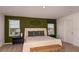 Cozy bedroom featuring a neutral color palette, comfortable bed, and stylish decor at 386 Wayland Dr, Haines City, FL 33844