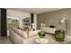 Stylish living room with a comfortable sofa, modern decor, and plenty of natural light at 386 Wayland Dr, Haines City, FL 33844
