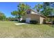 Barn with neutral siding, double doors, and green grass at 40600 Louise Rd, Umatilla, FL 32784