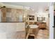 Elegant bathroom with glass shower, soaking tub and wooden vanity at 40600 Louise Rd, Umatilla, FL 32784