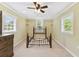 Bright bedroom featuring neutral walls, carpet flooring, and ample natural light from three windows at 40600 Louise Rd, Umatilla, FL 32784