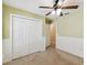 A bedroom featuring neutral walls, carpet, a ceiling fan, and a closet at 40600 Louise Rd, Umatilla, FL 32784