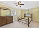 Cozy bedroom featuring carpet, natural light, and minimalist design at 40600 Louise Rd, Umatilla, FL 32784
