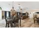 Open floor plan with living room and dining room featuring updated light fixtures at 40600 Louise Rd, Umatilla, FL 32784
