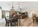 Open floor plan with living room and dining room featuring updated light fixtures at 40600 Louise Rd, Umatilla, FL 32784