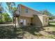 Exterior view of the building featuring a balcony and outdoor seating at 40600 Louise Rd, Umatilla, FL 32784