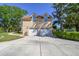 Inviting home with a large driveway and a two-car garage under the main living quarters at 40600 Louise Rd, Umatilla, FL 32784