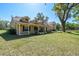 Charming single-Gathering home with a spacious lawn and covered front porch at 40600 Louise Rd, Umatilla, FL 32784